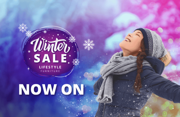 An image of a woman joyously looking upwards. She is wearing a knitted hat and scarf. The background is an abstract winter scene in vivid colours. There is a logo to the left that reads: Winter Sale - Lifestyle Furniture. Below, a headline says in bold text: NOW ON